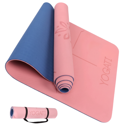 Pink yoga mat partly rolled showing blue textured non-slip reverse, with inset of mat held by black carry strap on white