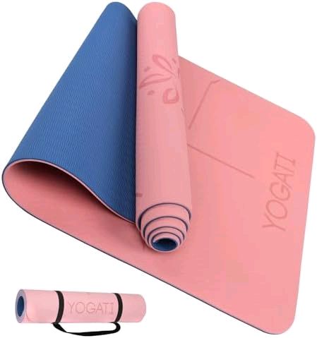 Pink exercise yoga mat partly rolled to show blue textured non-slip reverse, plus inset of mat rolled with black carry strap